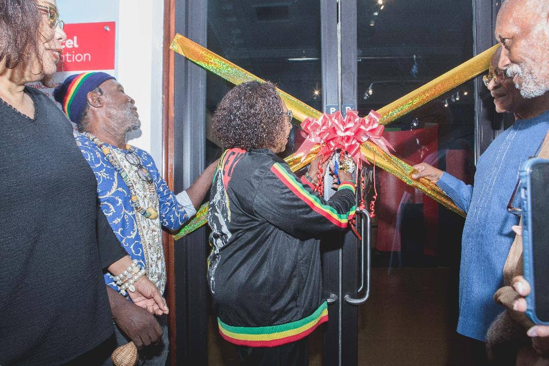 Minister of Culture, Gender, Entertainment and Sport, Olivia Grange, cuts the ribbon to officially open the Jamaica Music Museum’s exhibition ‘From African to Jamaican: Music and Creolized Black Culture’ at the Institute of Jamaica on Sunday, August 