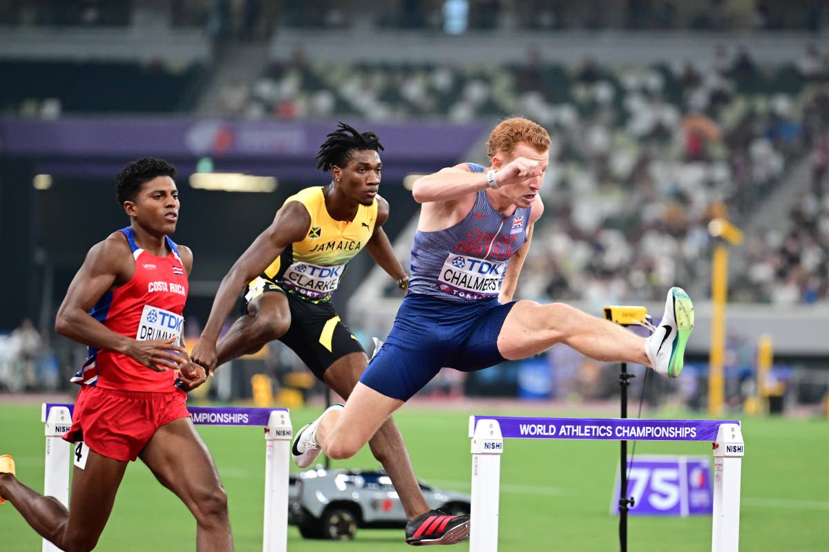 Roshawn Clarke (centre) clears a hurdle during heat three of the men’s 400-metre hurdles semi-finals. Clarke finished fourth in 48.37 seconds, failing to advance to the final.