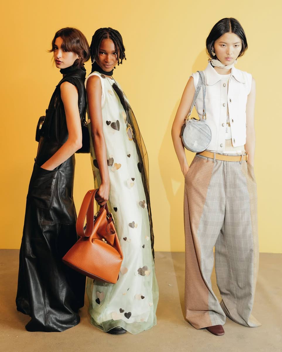 Jamaican model star Dru Campbell (centre)  backstage at the Coach show with peers, Argentine Justi Ageitos and Chinese Wei Yiting. The show was held at Pier 36 in downtown Manhattan on Monday.