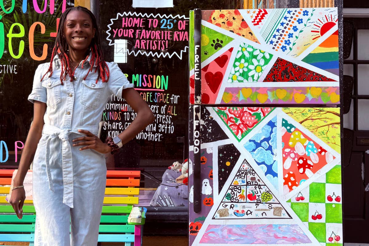 Taylor Scott, founder of RVA Community Fridges, poses with one of her fridges on E. Main Street in Richmond on Sunday, September 14, 2025.
