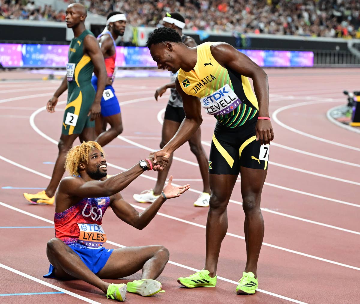 Jamiaca’s Bryan Levell (right) congratulates winner Noah Lyles of the United States shortly after the men’s 200 metres final on day seven of the World Athletics Championships. Levell placed third.
