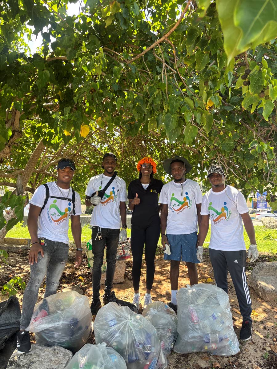 (From left): Igal Scott, Nickoy Binnie, Aaliyah Innis, Emeka Maxwell and Troy Cardwell pose for a photo after the beach clean-up exercise at Coral Gardens Citizen Association Beach in St James.
