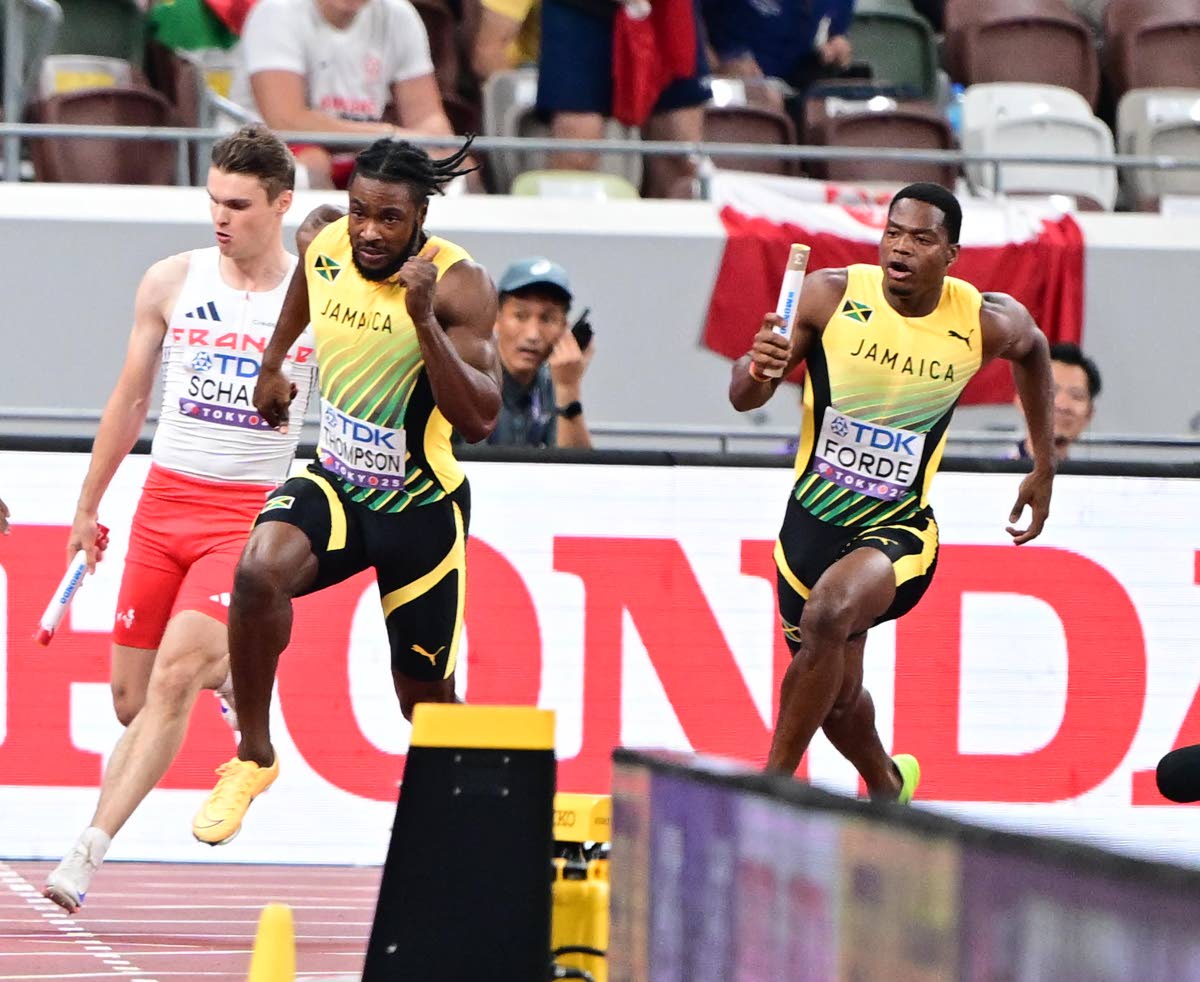 Ryiem Forde (right) of Jamaica on the approach to teammate Kishane Thompson for the anchor leg baton exchange in the men’s 4x100m relay heats. The exchange was not completed and Jamaica failed to advance to the final at the 2025 World Athletics Champions