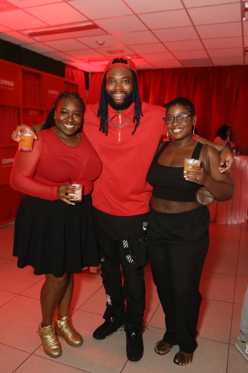 Radio personality and disc jockey Brush 1 the Road Marshall, decked out in red and black, is flanked by creative project and tour manager Lauren ‘Lo’ Watkis (left) and Cheraine Marshall, music executive of the Tastemaker Agency.