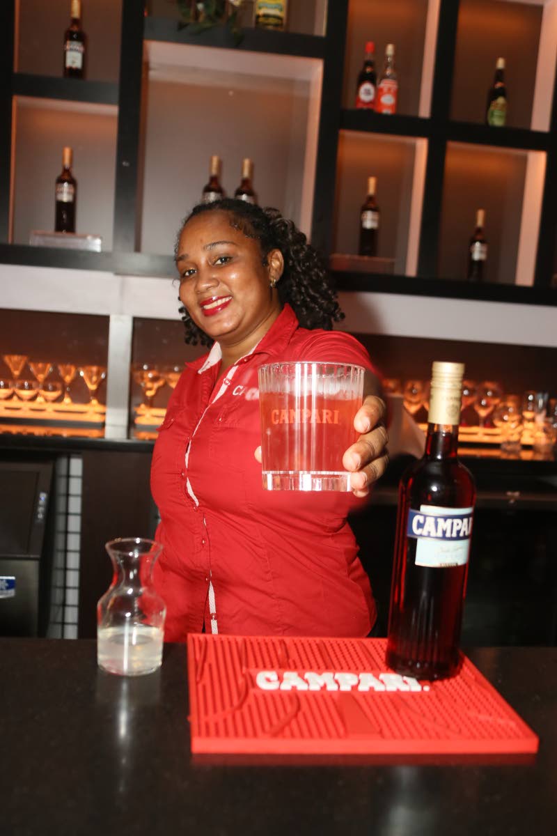 Mixologist Chantal Wilson presents the quick and easy Campari Grapefruit which was served during Campari’s new bottle launch lyme event.