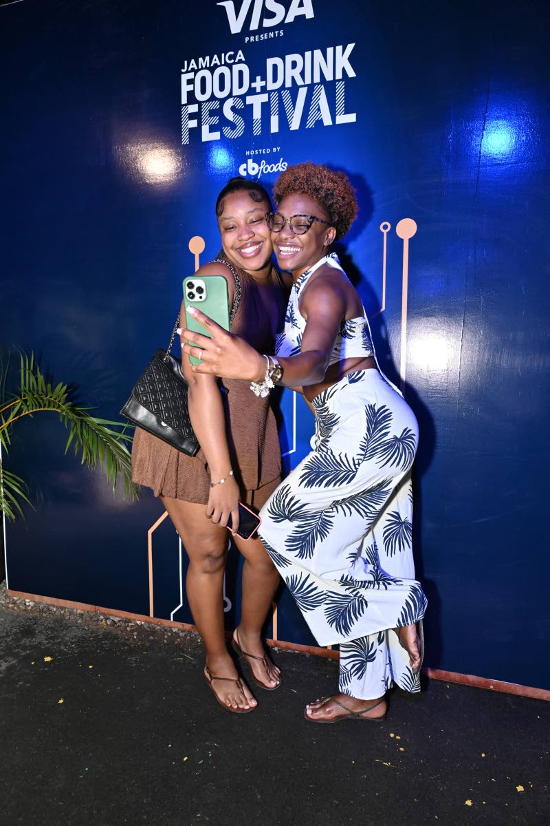Lamoya Mullings (right) and Kourtney Clayton are all smiles, snapping a selfie at the Visa booth.