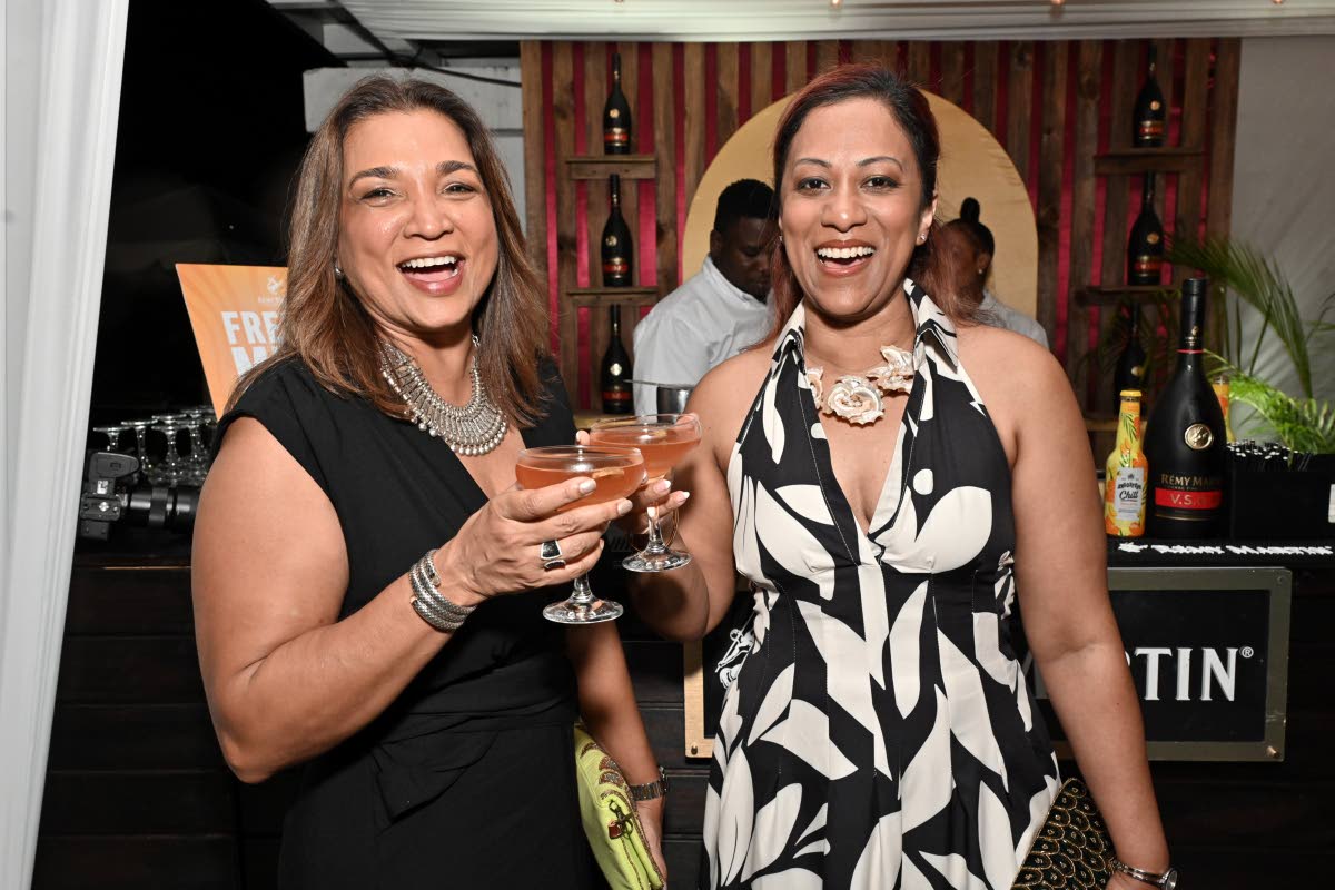 Toasting to a great night are friends and business partners Denise Williams (left) and Stacey Luces.