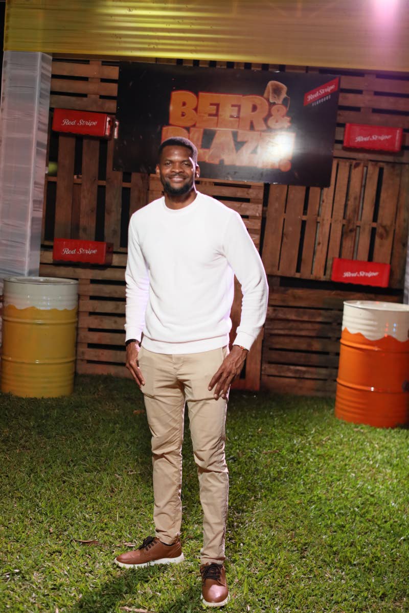 Kijana Johnson, councillor for the Race Course division, keeps it sleek, pairing a crisp white sweater with tailored khakis and polished brown sneakers. 