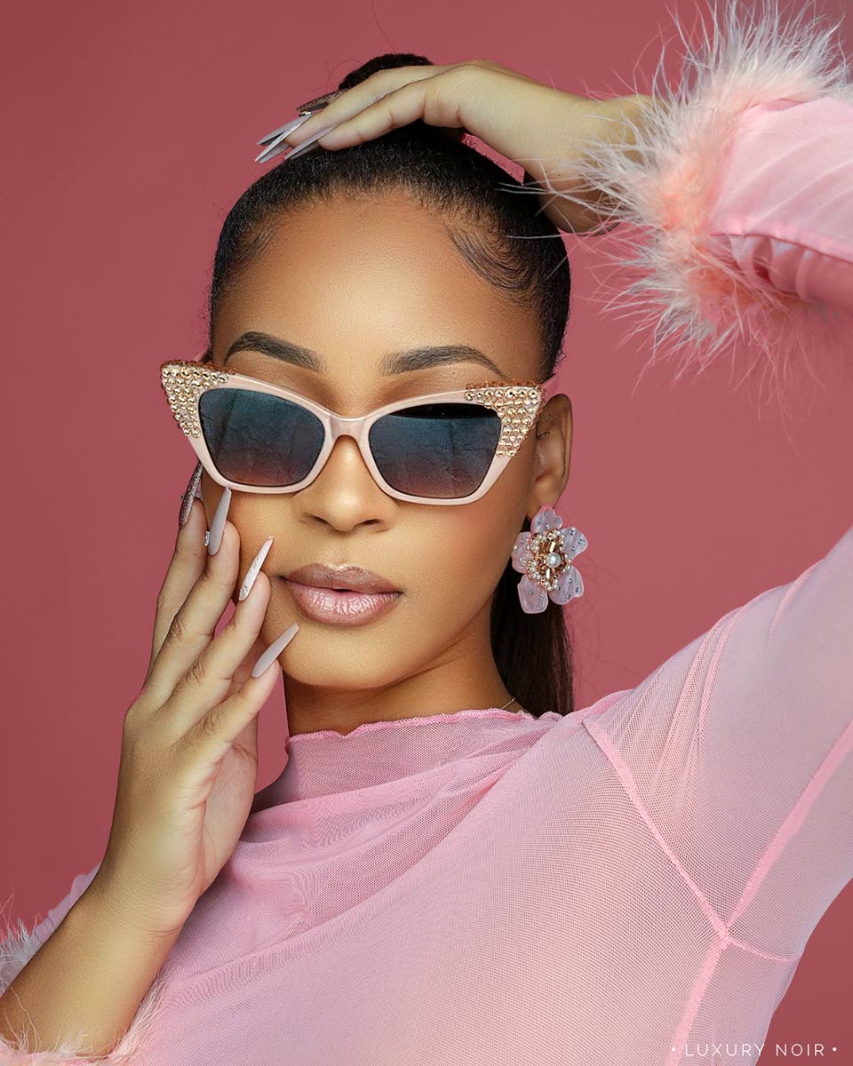 Right: Strike a pose: With fur in the mix, AnnaleaX opts for fun and playful glam in baby pink.