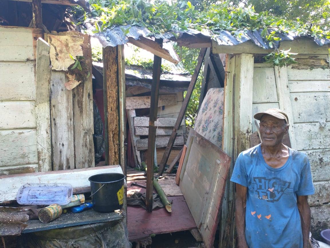 A dejected Rudy Campbell outside his ravaged home in Castleton, St Mary.