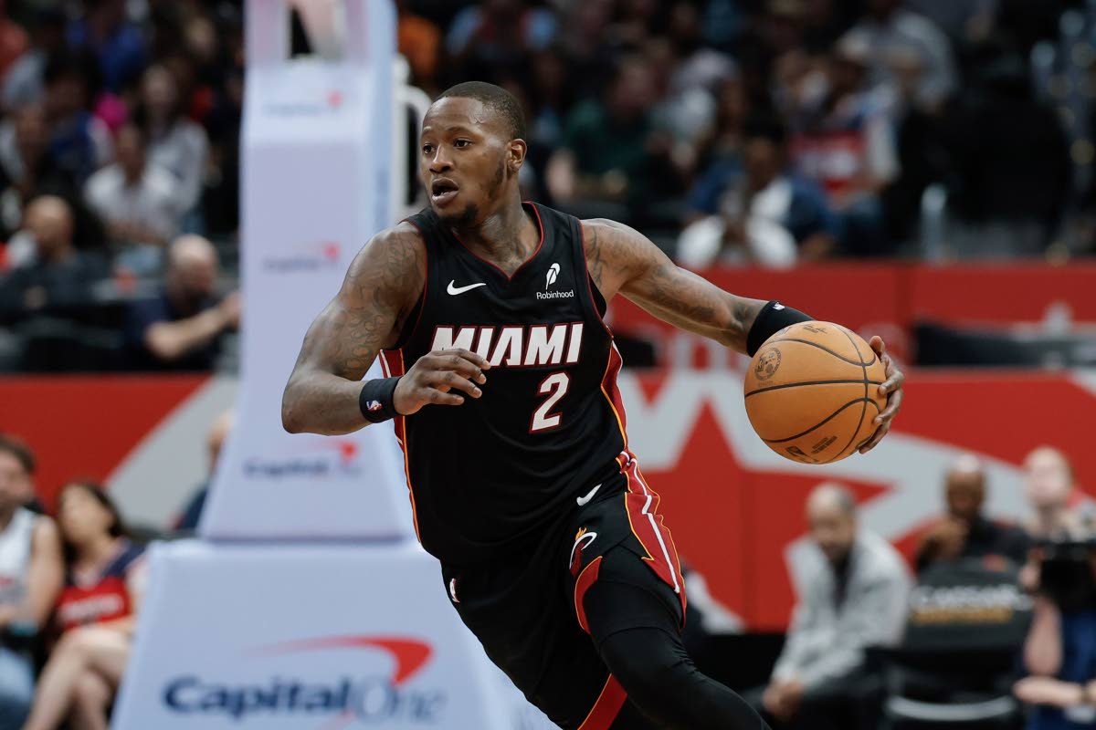 Miami Heat guard Terry Rozier brings the ball up court during the second half of an NBA basketball game against the Washington Wizards in Washington, Monday, March 31, 2025.