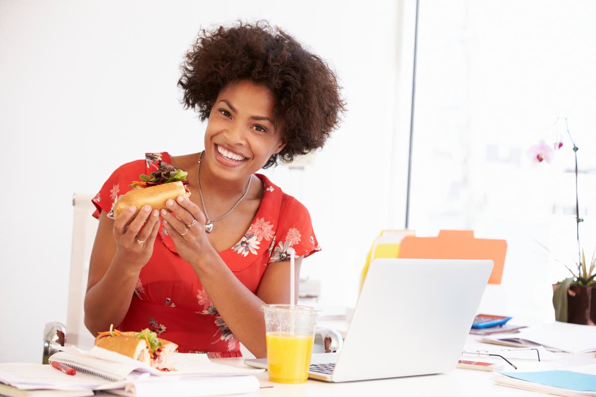 Representational image of a working woman taking a lunch.