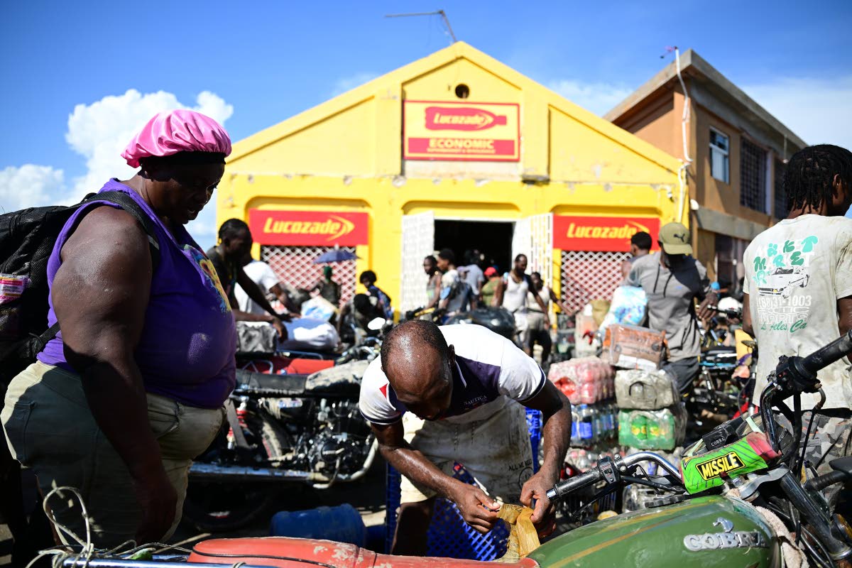 Residents of Black River and surrounding communities descend on the shopping district of the St Elizabeth capital in search of food and other supplies last Thursday.