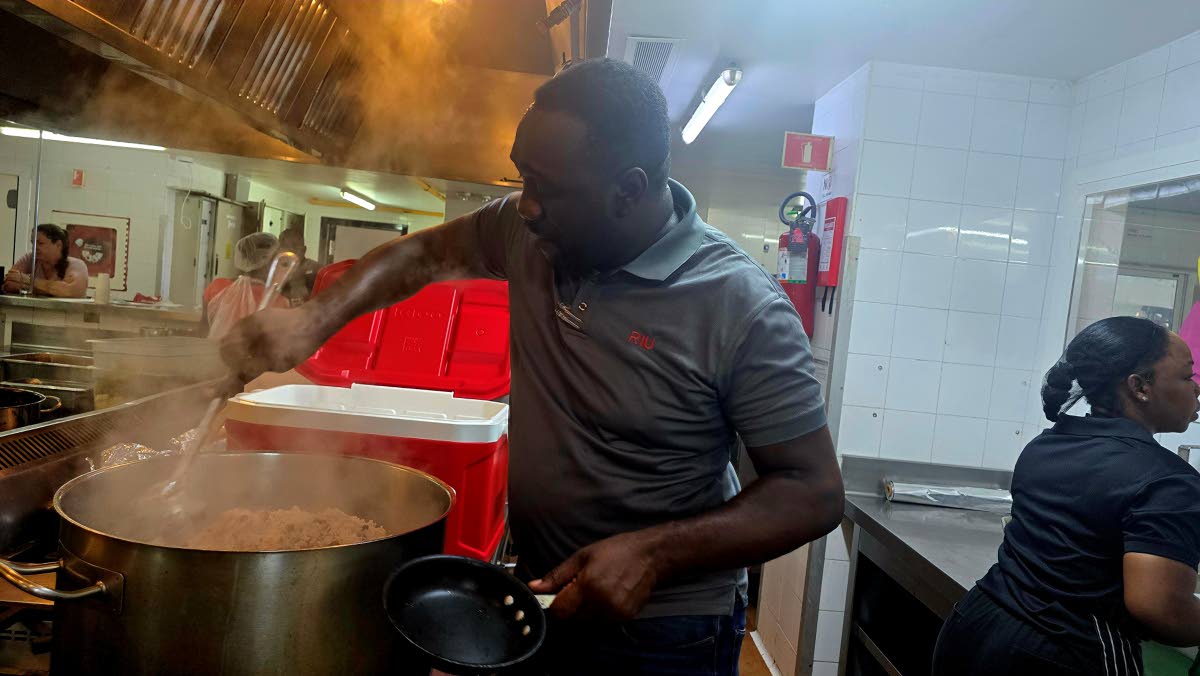 RIU Resort Jamaica’s Radley Howard cooking rice and peas to be distributed by World Central Kitchen volunteers to residents affected by Hurricane Melissa.
