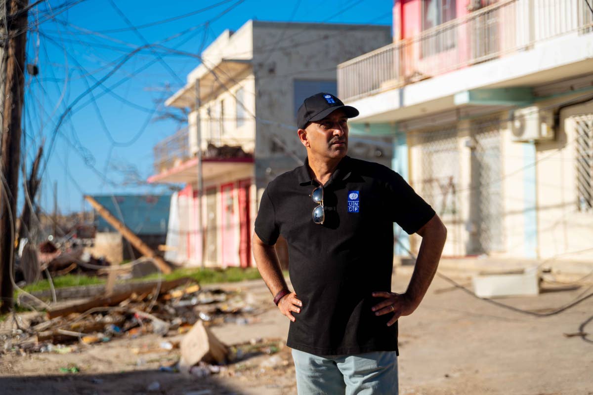 United Nations Development Resident Representative to Jamaica, Dr Kishan Khoday surveys the damage done in Black River, St Elizabeth in the aftermath of Hurricane Melissa.