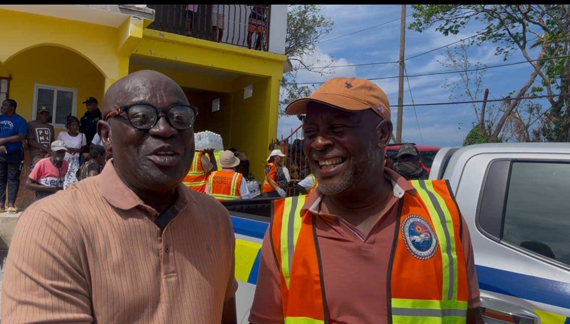 Lucea’s Mayor Sheridan Samuels (left) expressing his gratitude to Portmore’s Mayor Leon Thomas for the supplies he brought the people of Hanover.