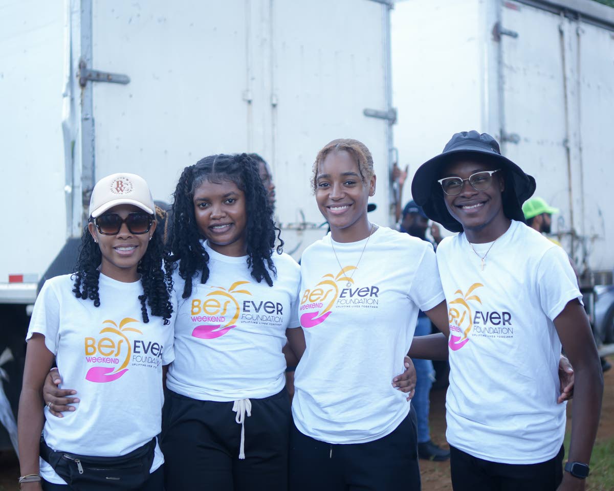 Best Weekend Ever Foundation volunteers (from left) Trayce-Ann Henry, Kiana Gordon, Jada Phillips, and Omari Aekins, pause for a photo while lending a hand.