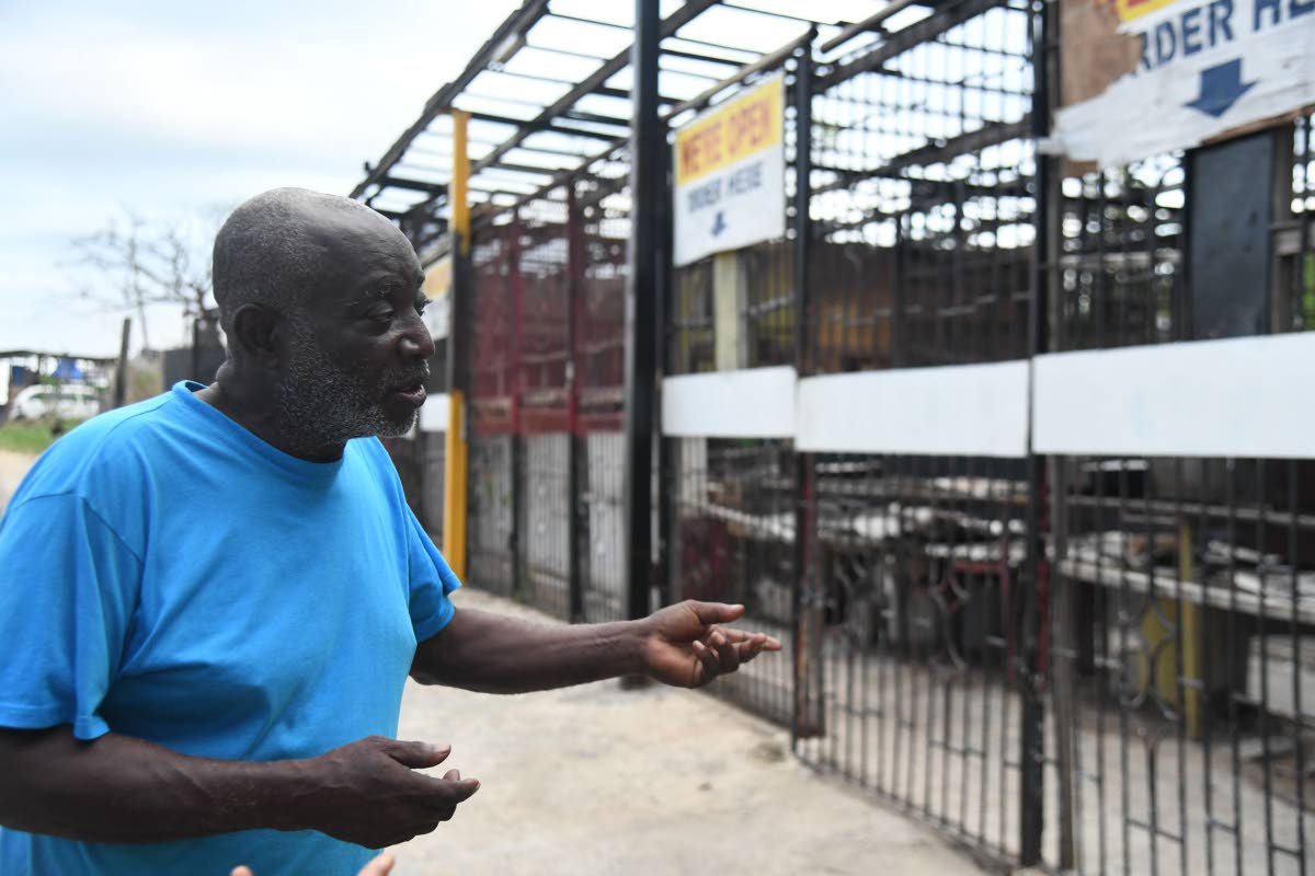 Rudolph ‘Howie’ Valentine Salmon looks at his once-thriving roadside kitchen nicknamed ‘100 Pot’ in Middle Quarters.
