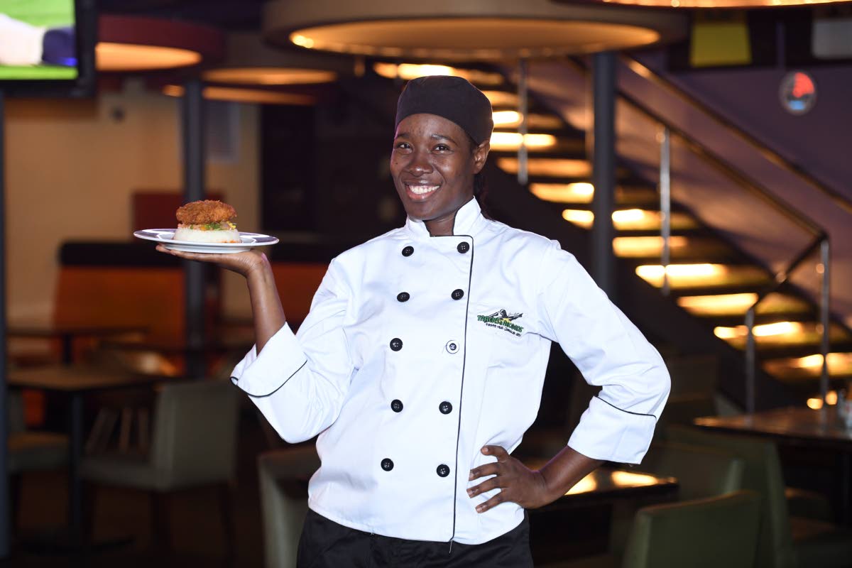 Executive Chef Trishauna McMaine of Usain Bolt’s Tracks and Records presents a scrumptious plate of coconut-crusted fish fillet, strategically placed on a bed of avocado salad and jasmine rice.