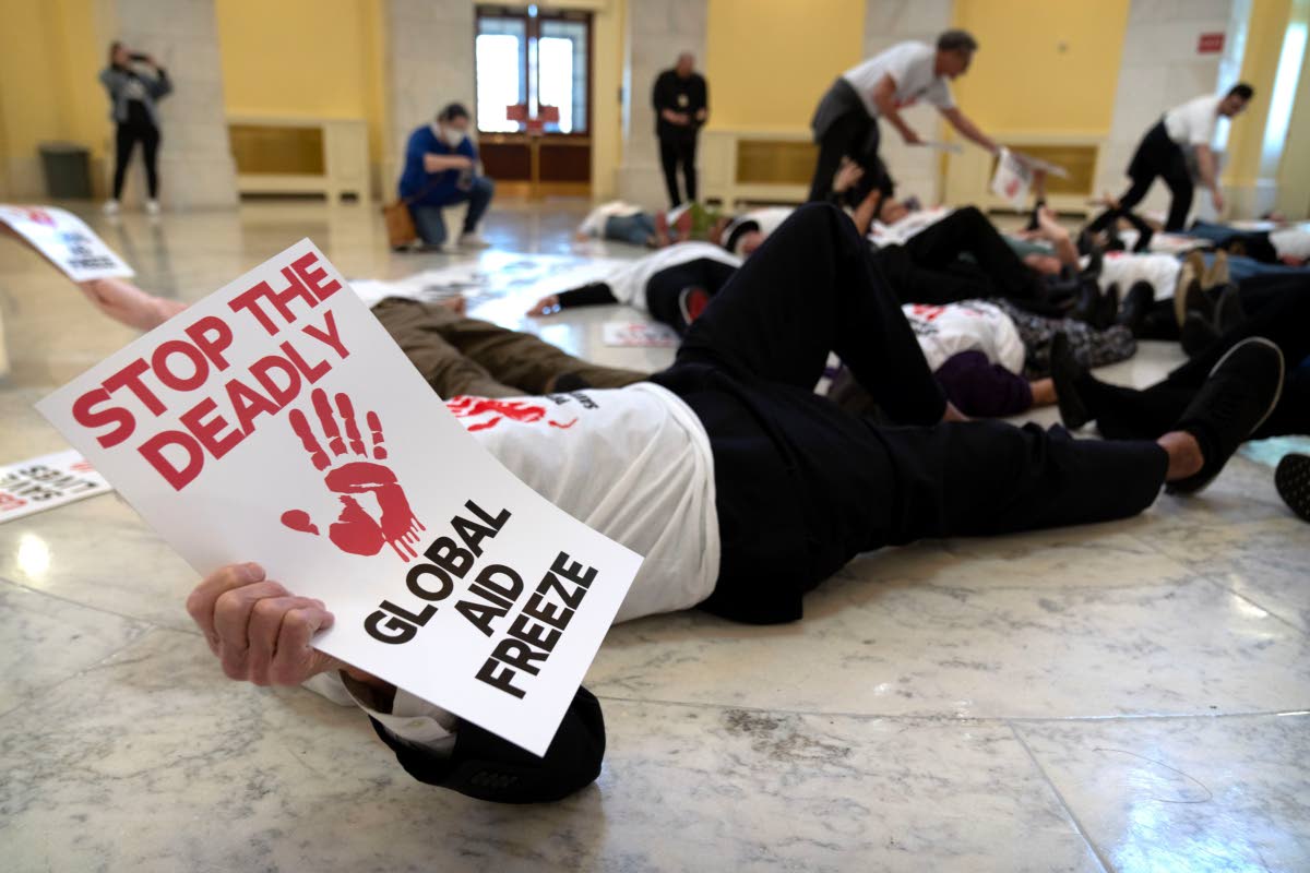 Demonstrators protest against cuts to American foreign aid spending, including USAID and the PEPFAR programme to combat HIV/AIDS, at the Cannon House Office Building on Capitol Hill Washington DC. 