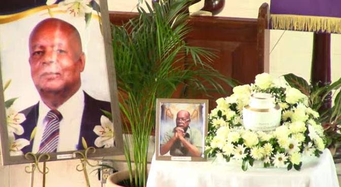 Portraits of the late businessman Ruel Alphanso Crawford on display during his thanksgiving service at the Ridgemount United Church in Mandeville, Manchester, yesterday.