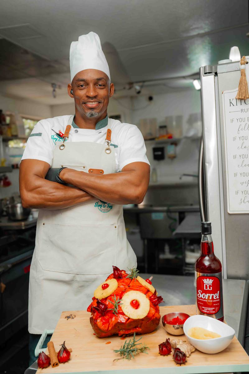 Chef Durren McClean, managing director of Surf and Turf Catering, poses with his D&G Sorrel Rum glazed ham.