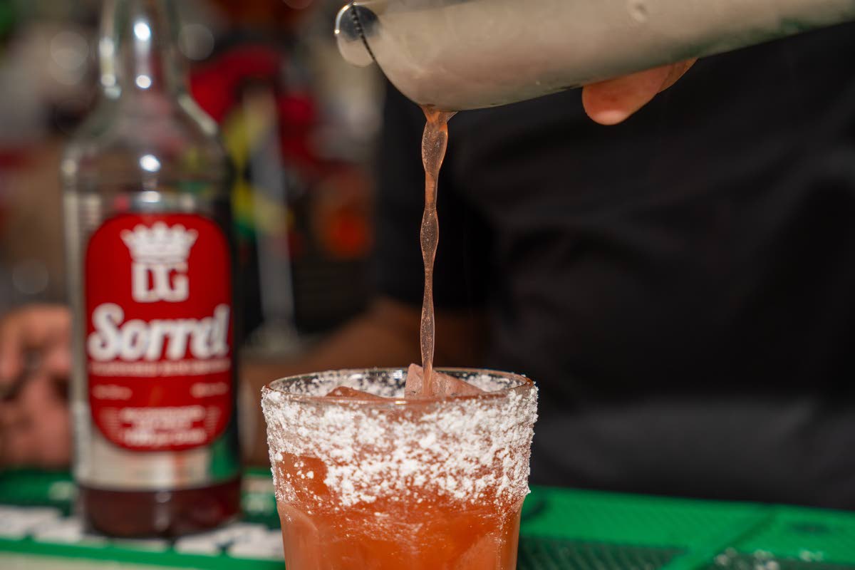 Mixologist Theo Miller prepares the D&G velvet sorrel cocktail.
