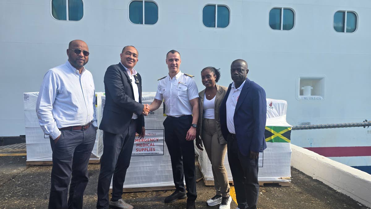 Minister of Health and Wellness Dr Christopher Tufton (second left) accepts medical supplies valued at US$1 million from Carnival Corporation’s captain Nick De Ranier (centre) and Senior Vice-President Marie McKenzie (second right). Sharing in the occasi