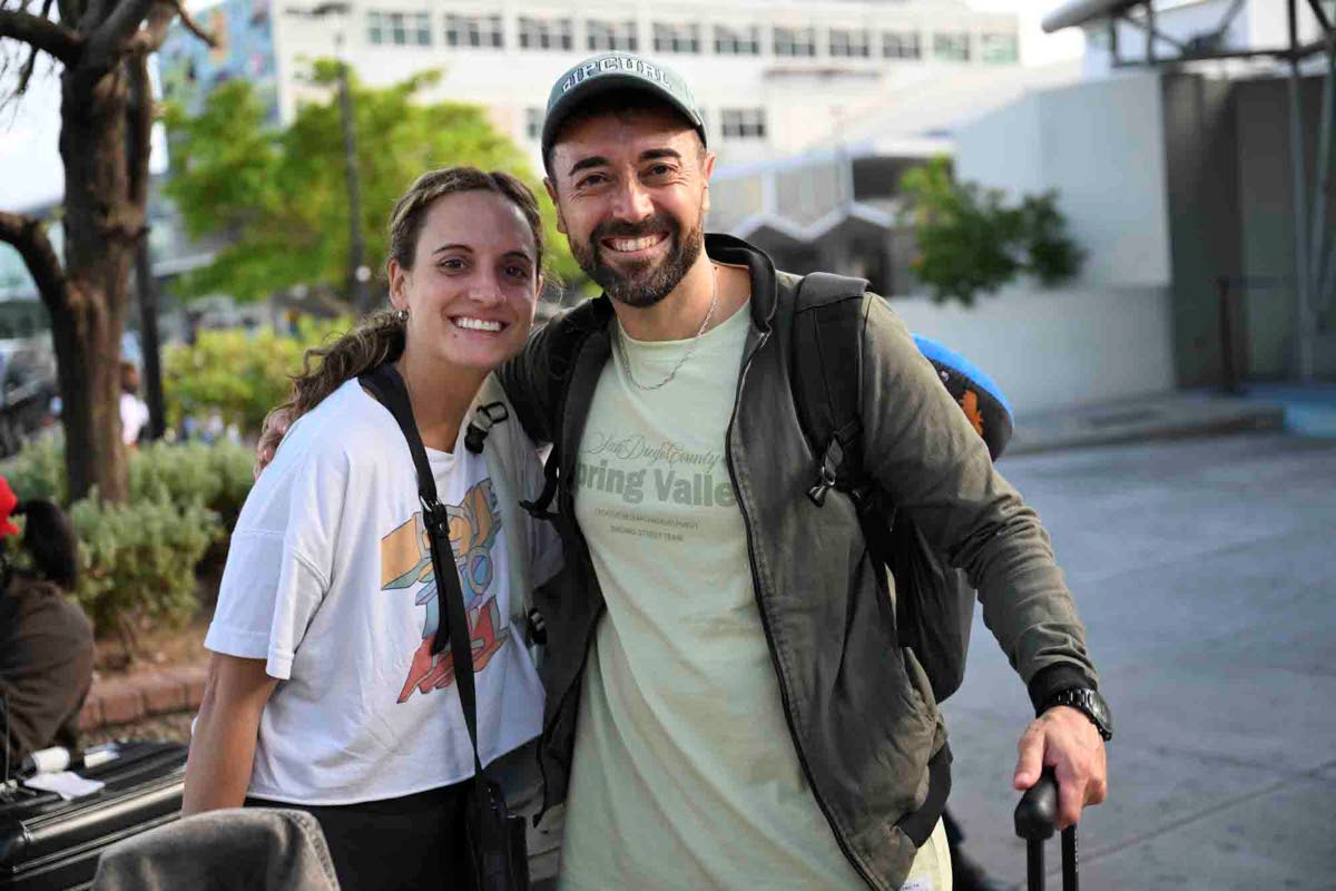 First-time visitors Florencia Dellanno and Juan Del Roo, software professionals from Argentina, are looking forward to enjoying jerked chicken and relaxing for the holidays.