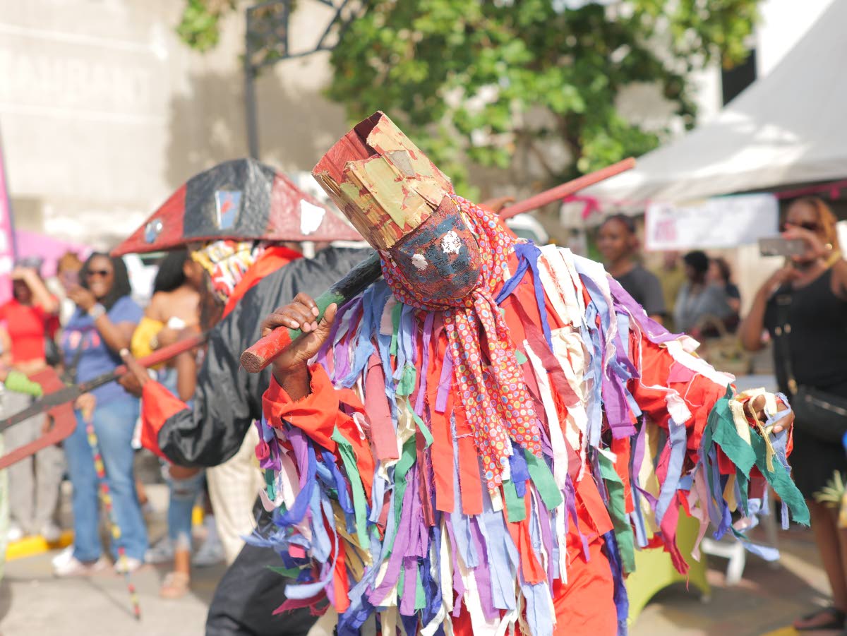 Pitchy Patchy from the Southwest St Andrew Jonkunnu Group is captured during the group’s performance on Sunday. 