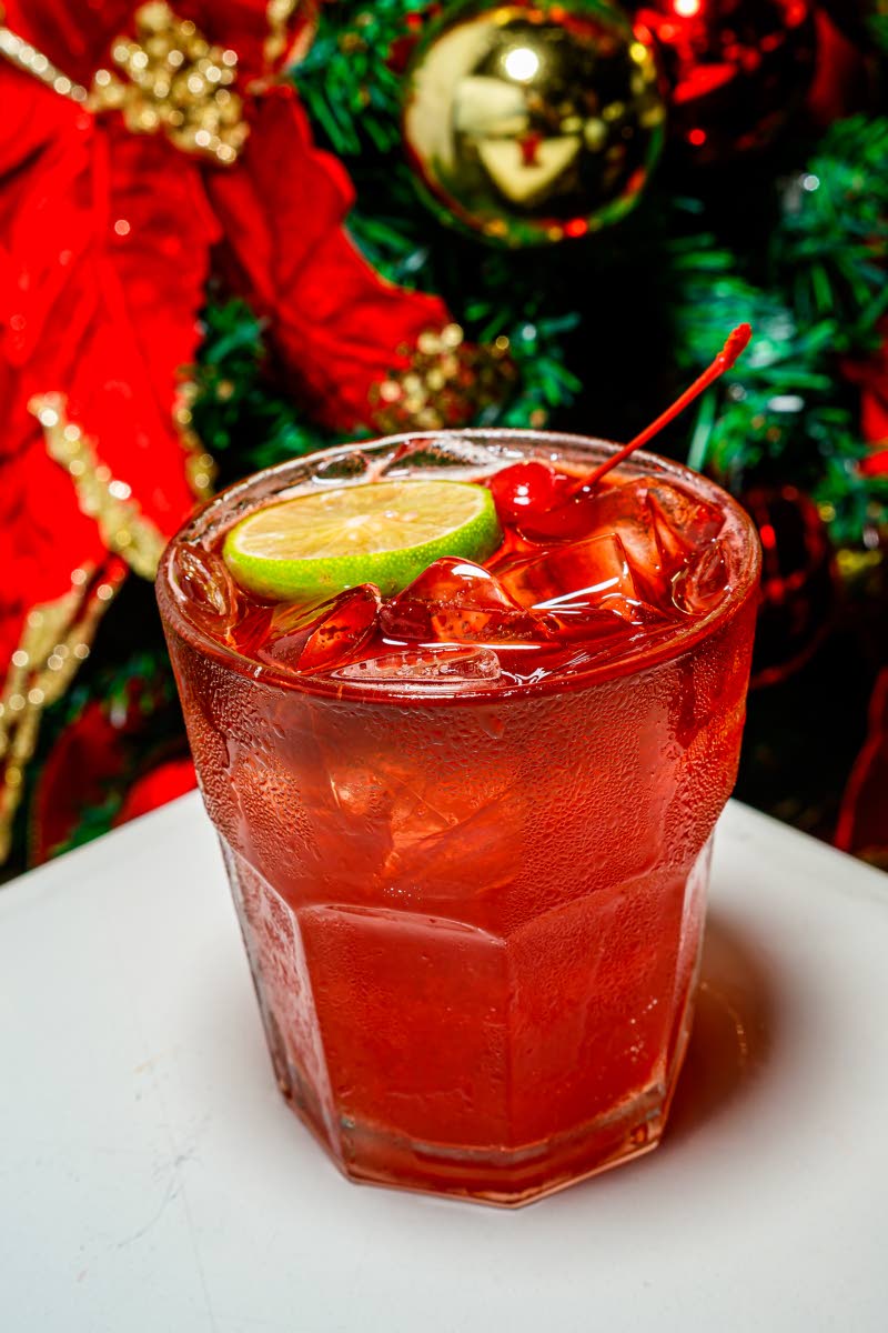 The midnight sorrel cocktail is served over ice.