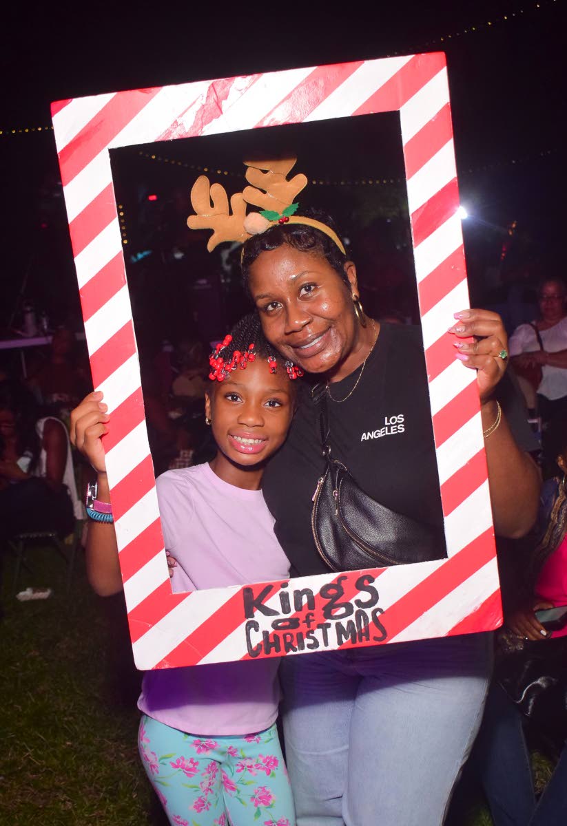 Mother-daughter duo Kerida (right) and Alyssa Black takes a moment to snap a photo during the Kings of Christmas concert on Sunday.