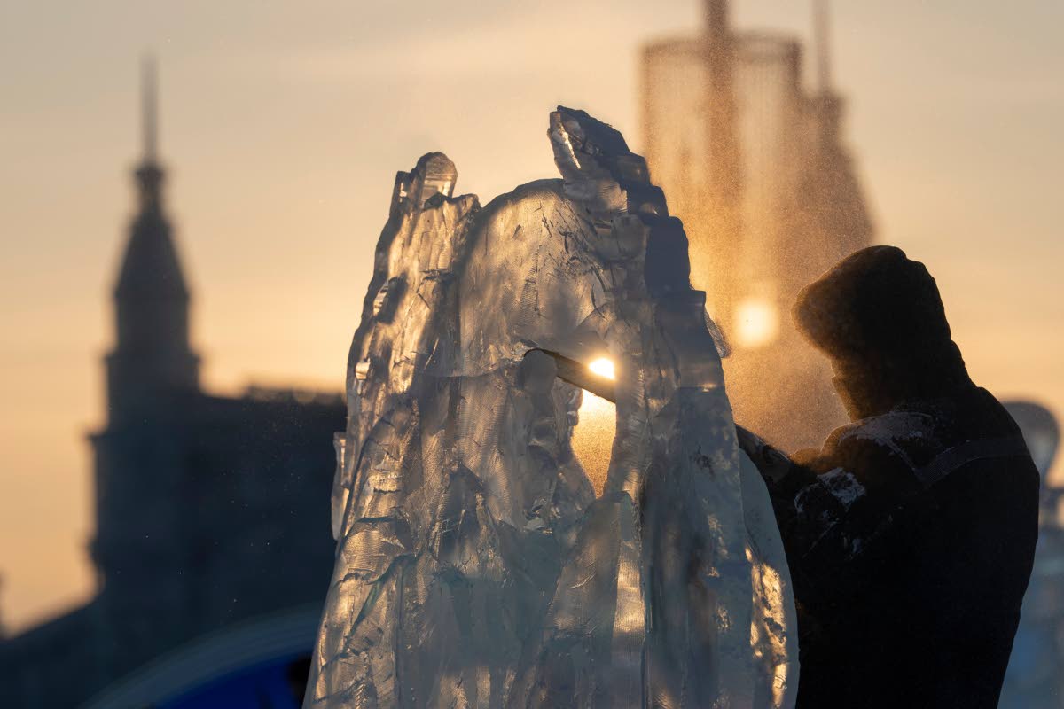 An ice sculptor prepares his work for competition in the annual Ice and Snow Festival held in Harbin in China’s Heilongjiang province.