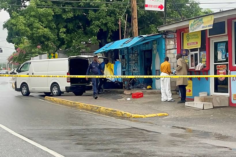 Investigators combing a crime scene following a double murder and shooting in Barbican, St Andrew, in April 2025. 