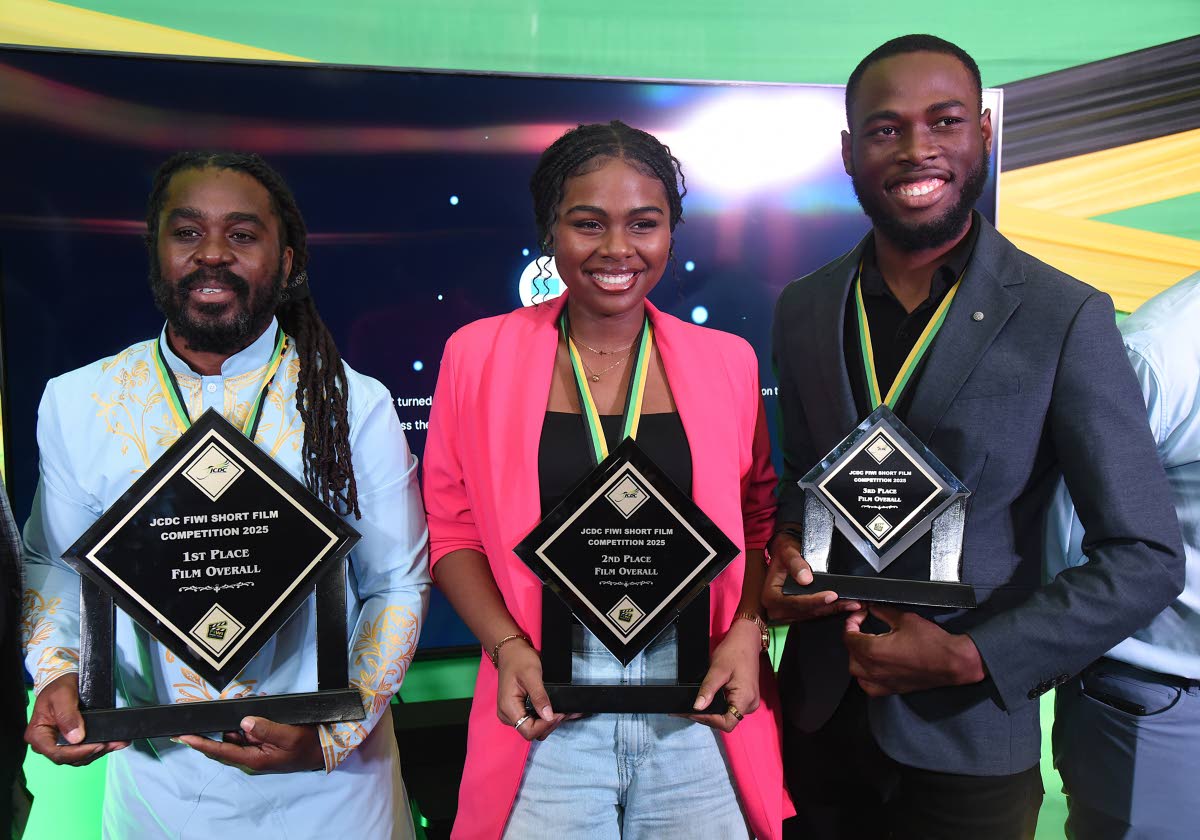 Omaall Wright (left), first place winner in the Jamaica Cultural Development Commission Fiwi Short Film Competition, shares the spotlight with second and third places winners, Paris Taylor (centre) and Shemar Grant.