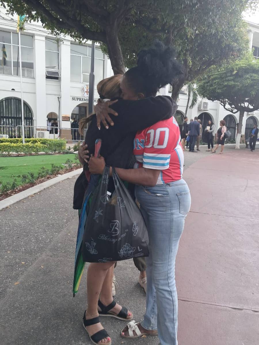 Sophia Lugg (left), mother of Donna-Lee Donaldson, celebrates the guilty verdict with her sister and Donaldson’s aunt, Johana Lugg.