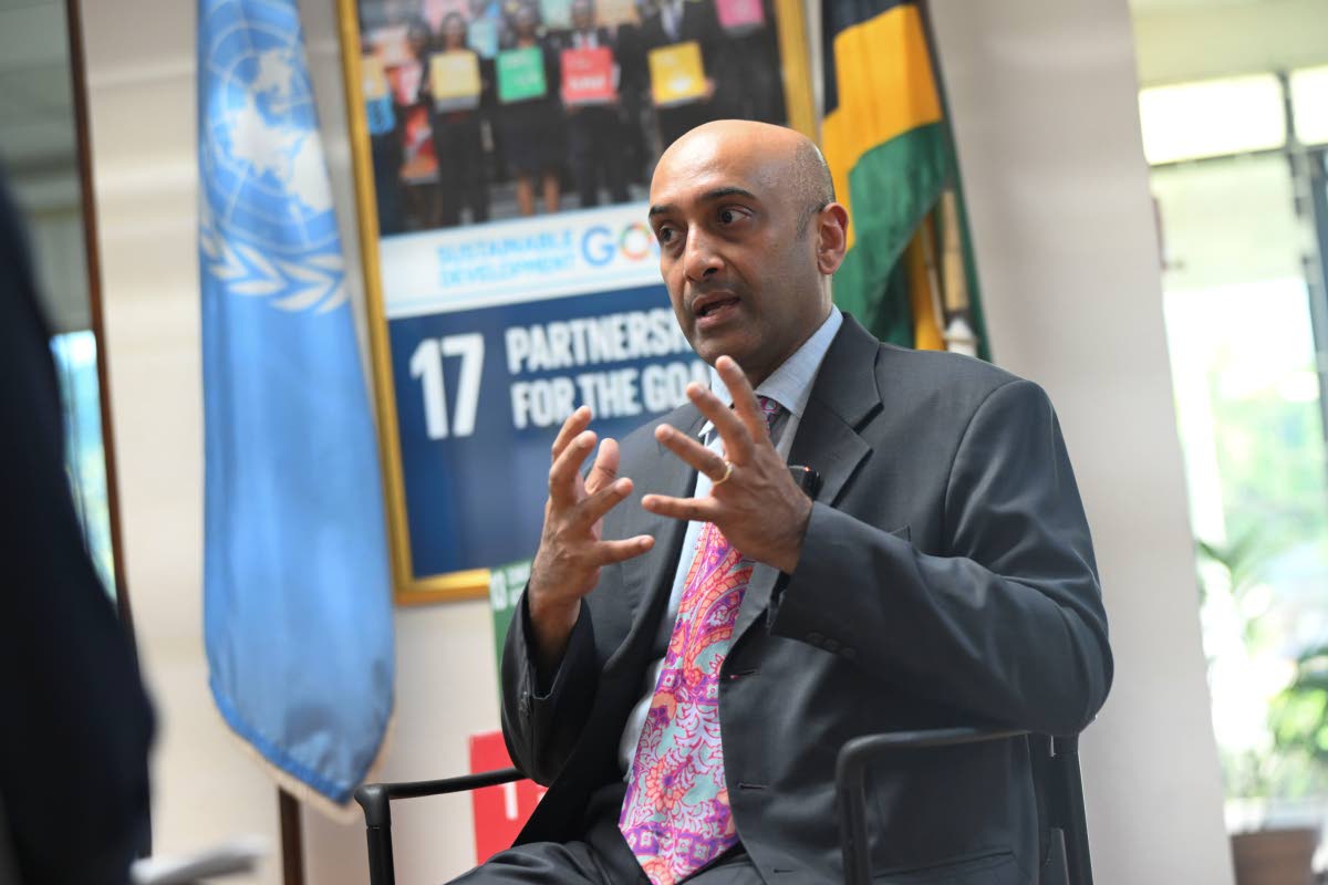 left: Kishan Khoday, the UNDP’s resident representative for The Bahamas, Belize, Bermuda, Cayman Islands, Jamaica, Turks & Caicos.