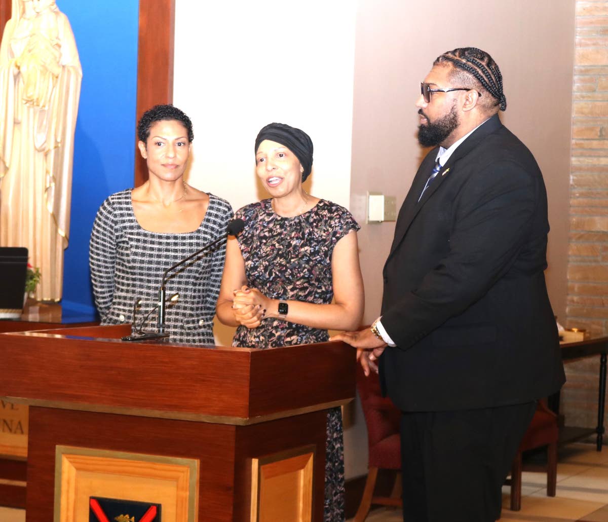 Daughters Myesha (left) and Tamara and son Kareem Ward pay tributed to their father, the late Ambassador Curtis Ward. 