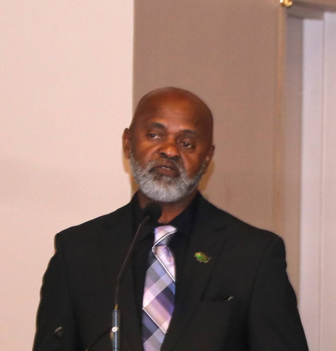 Irwine Clare, co-founder and managing director of Caribbean Immigrants Services, delivers his tribute during the thanksgiving  service for Ambassador Curtis Ward.
