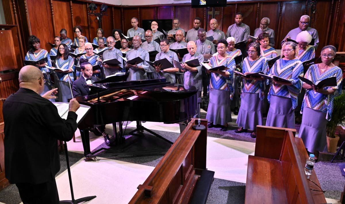 Winston Ewart (front), NCOJ director, during the Chorale’s season-opening concert at the UWI Chapel, Mona, Kingston on Sunday.