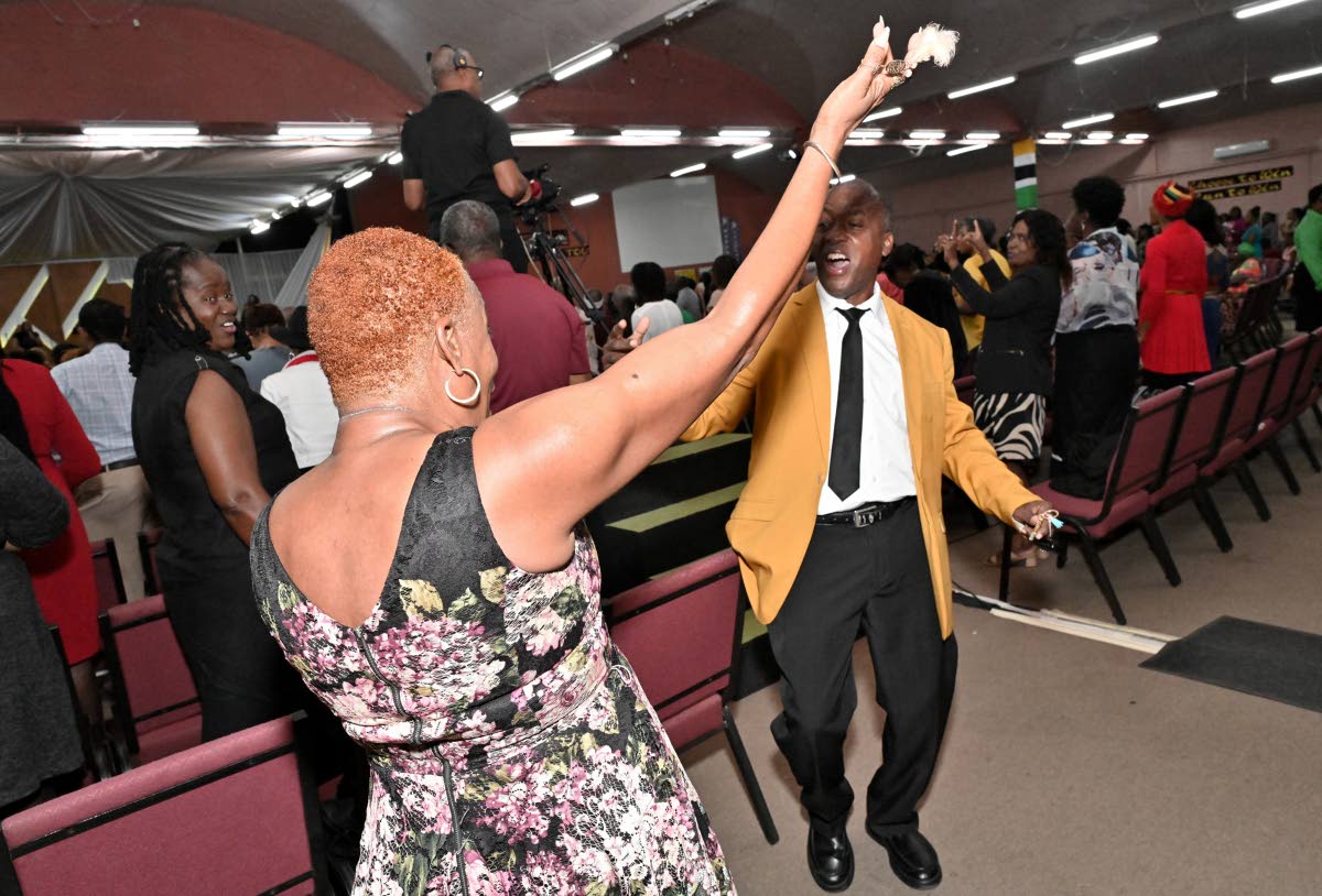 Anna Fontenelle-Bennett (left) and Karl Downer dancing during the praise and worship session at the recent Reggae Month Church Service ‘Reggae...A Balm In Gilead” at the Fellowship Tabernacle on Fairfield Avenue in Kingston.