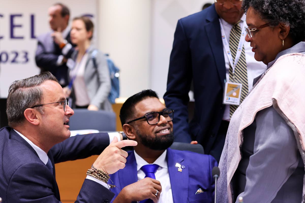 Luxembourg’s Prime Minister Xavier Bettel, Guyana’s President Irfaan Ali and Barbado’s Prime Minister Mia Mottley, from left, talk at the roundtable during the third EU-CELAC summit that brings together leaders of the EU and the Community of Latin Am