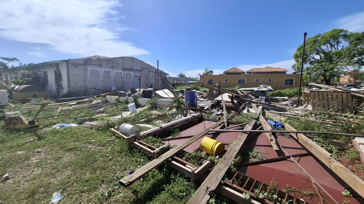 A nearby building damaged following the passage of Hurricane Melissa. 