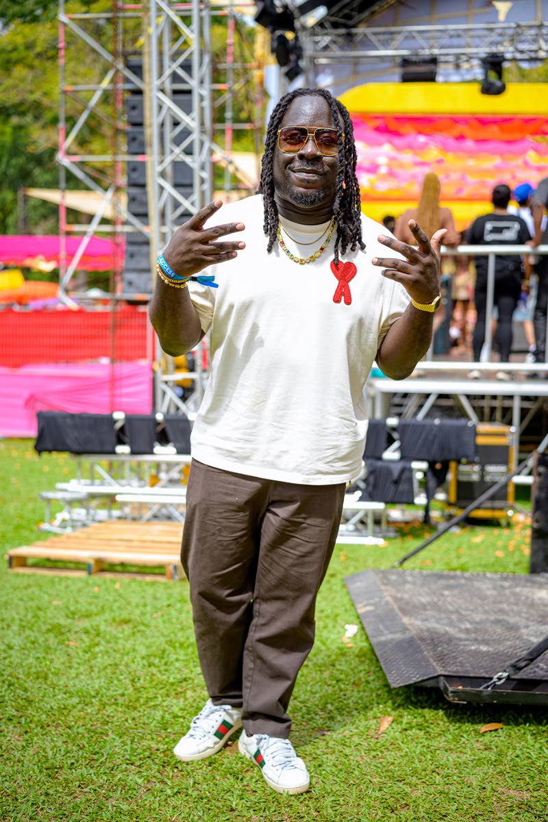 Deejay Bloodline Franco keeps it clean in relaxed neutrals, pairing an Ami Paris tee with crisp brown trousers and Gucci sneakers.