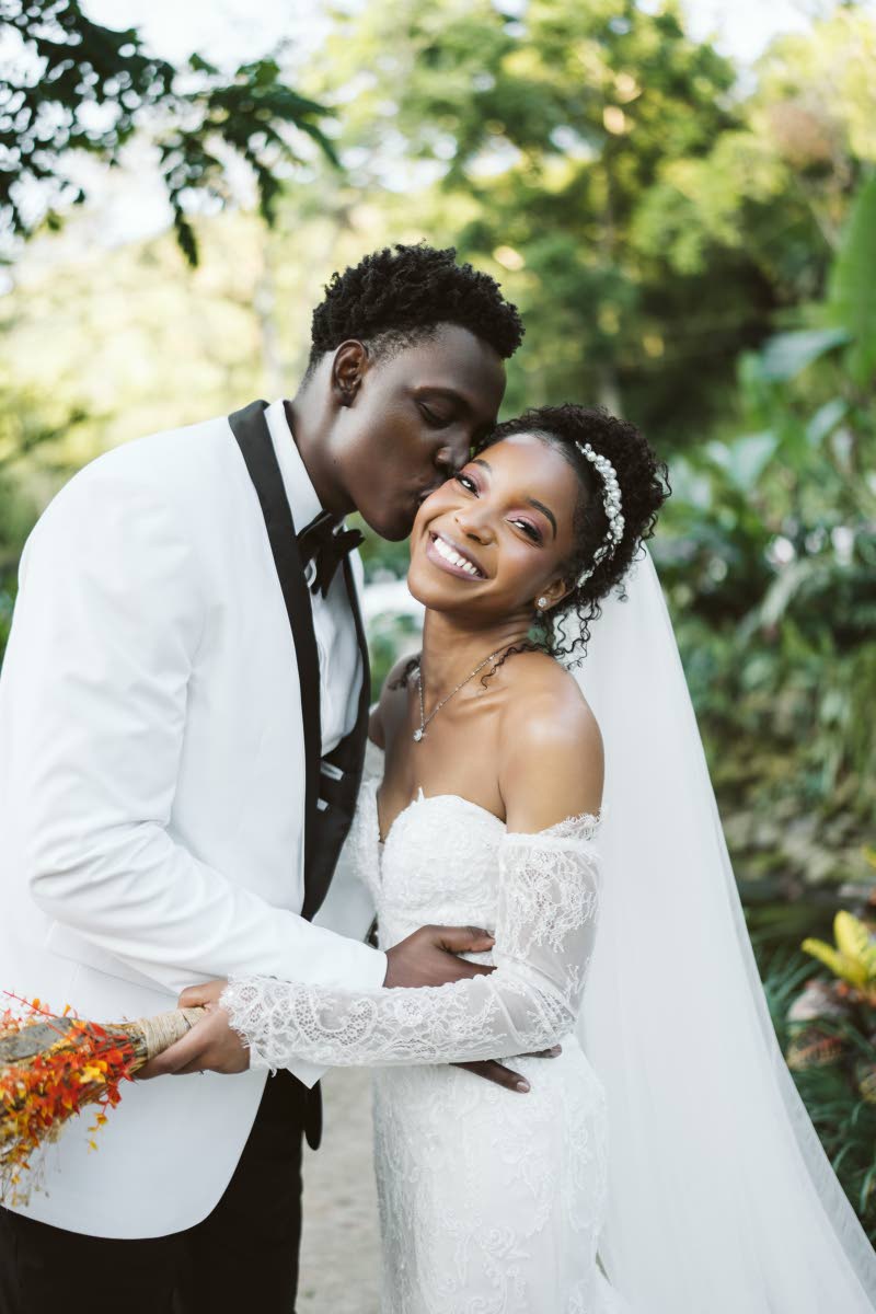 Dalkeith plants a kiss on his ladylove, Rohanna.