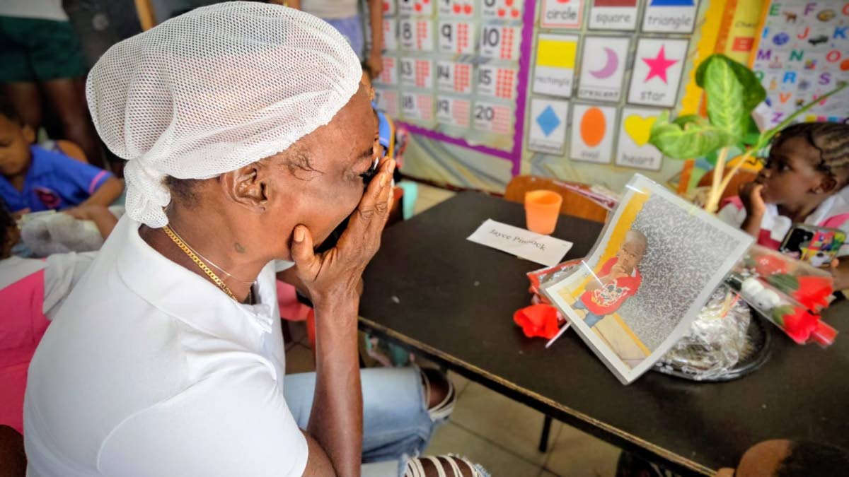 Ladonna Cunningham is moved to tears by this memorial at Jace’s desk.