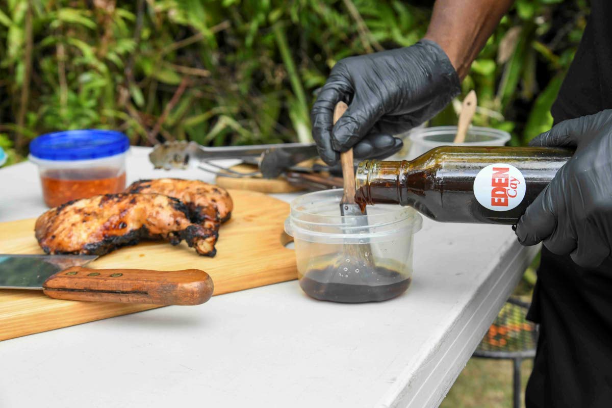 Keaveny pours his jerk teriyaki marinade, which includes ginger and Scotch bonnet pepper, ahead of brushing it onto fresh-from-the-grill chicken.