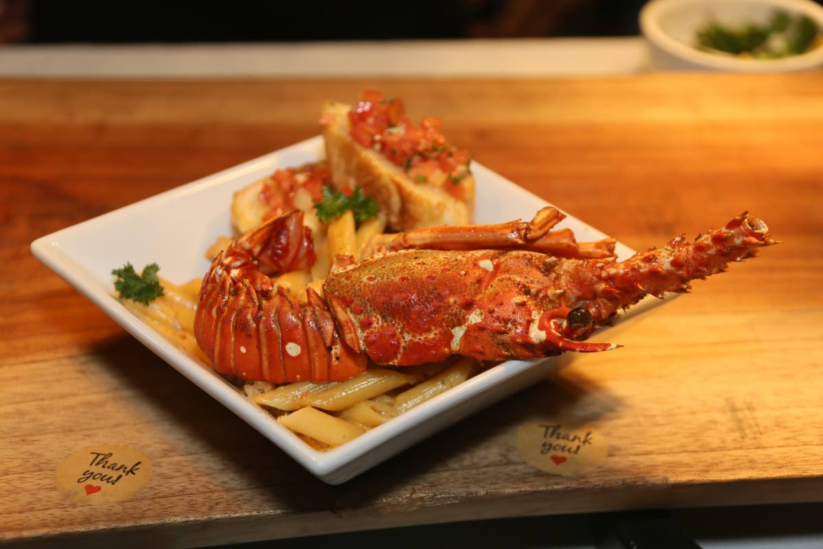 Brian Lumley’s lobster penne Alfredo, topped with tomato bruschetta and garlic bread.