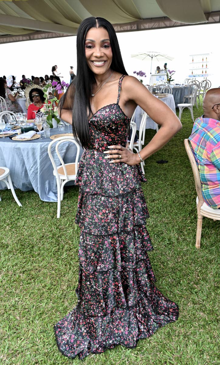 Belinda Williams, interim head, group sales and marketing unit at National Commercial Bank, looks fine and fabulous, standing tall in a floral, ruffle-tiered dress.