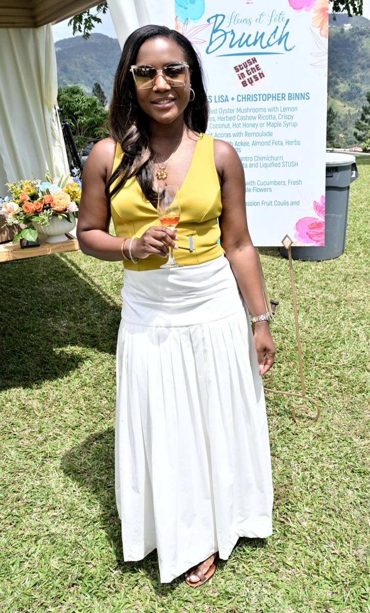 Theola Bruce, manager, Sagicor Investments, soaks up the afternoon brunch.
